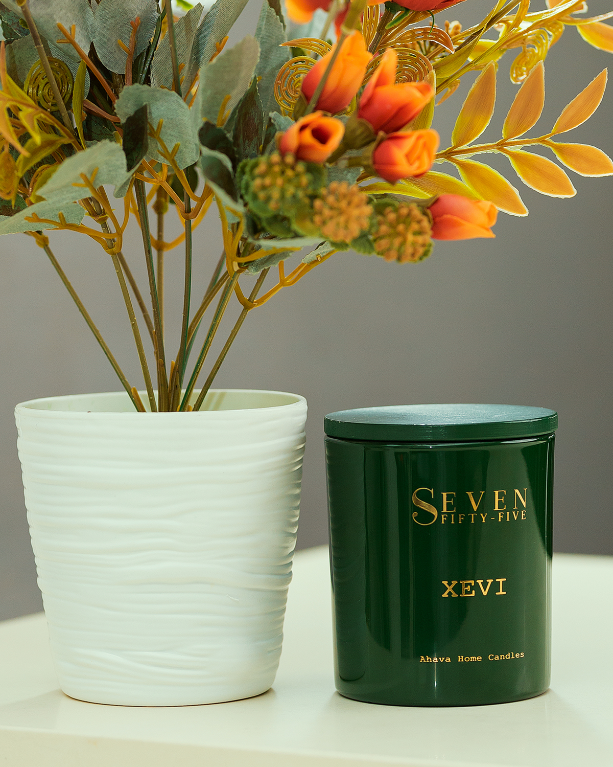 Seven Fifty-Five Xevi scented candle, lit