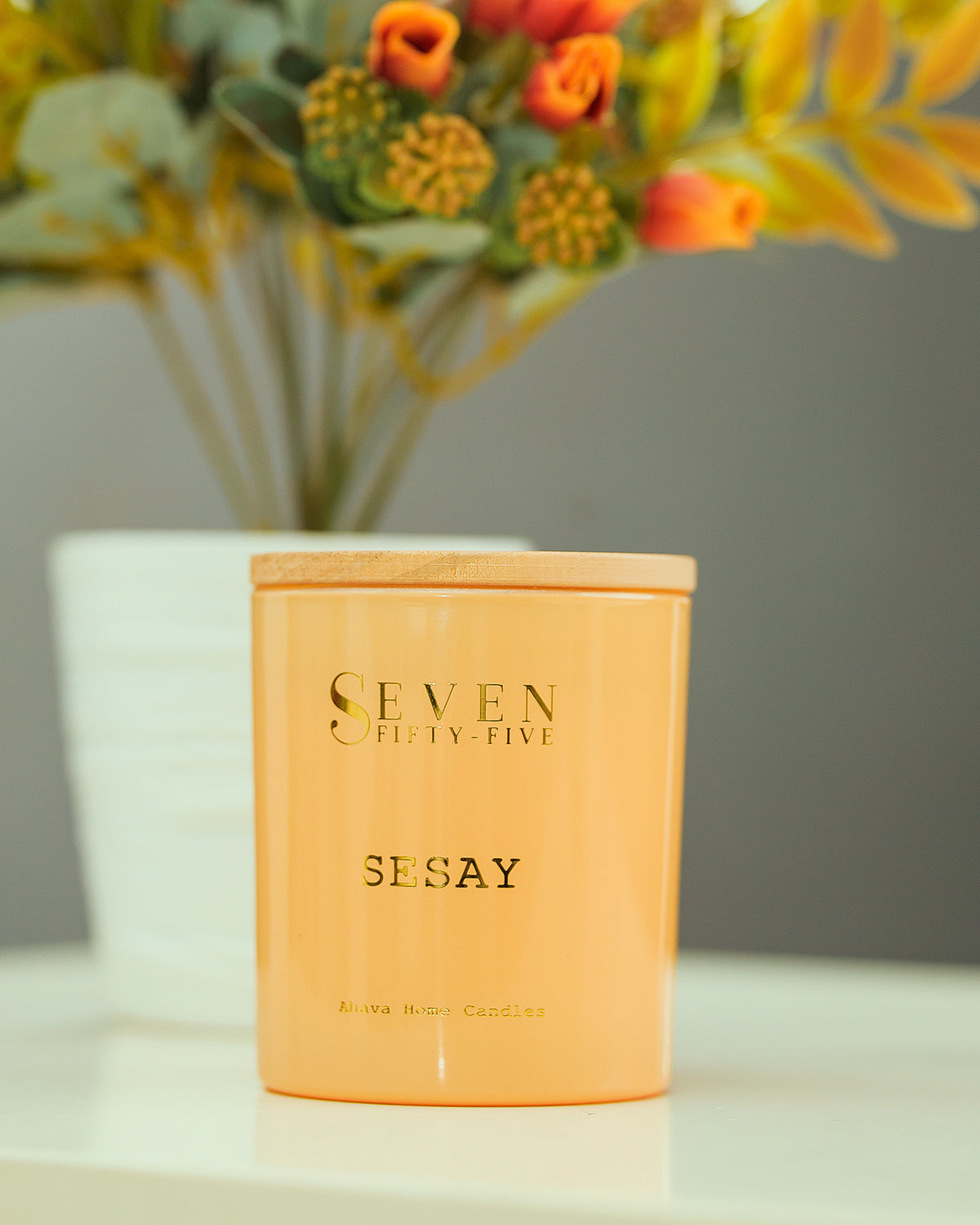 Seven Fifty-Five Sesay scented candle, lit