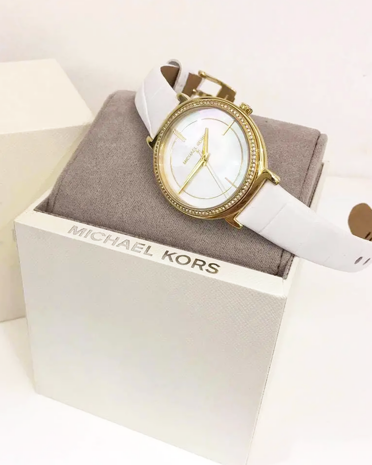 Michael Kors Cinthia MK2662 silver-tone women's watch with white leather strap - on wrist